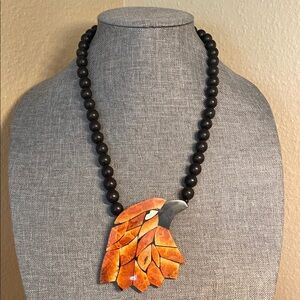 Lee Sands Black Beaded Necklace with Inlaid Orange Tiger Coral Bird Pendant